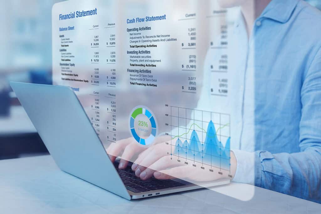 Financial reports and performance data displayed on a laptop representing financial statement preparation services.
